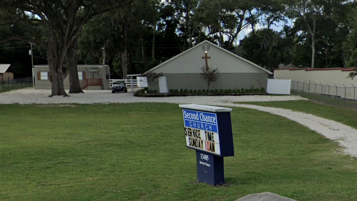 Second Chance Church Exterior with Sign in Front Yard